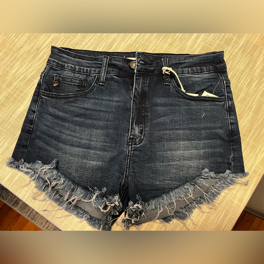 Jean shorts, shredded ends.